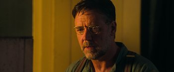 Movie still from “The Water Diviner” (2014), directed by Russell Crowe – A person wearing glasses; Close Up shot, Low angle
