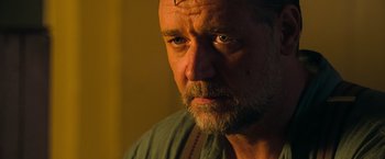 Movie still from “The Water Diviner” (2014), directed by Russell Crowe – A person with a beard looking at the camera; Close Up shot, Low angle