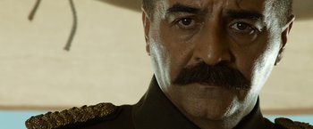 Movie still from “The Water Diviner” (2014), directed by Russell Crowe – A man with a mustache; Close Up shot, Over the shoulder angle