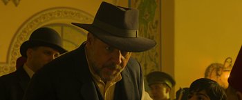 Movie still from “The Water Diviner” (2014), directed by Russell Crowe – An older man wearing a hat and a jacket; Close Up shot, Low angle