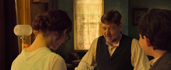 Movie still from “The Water Diviner” (2014), directed by Russell Crowe – A man and a woman are talking in a room; Medium shot, Over the shoulder angle