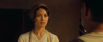 Movie still from “The Water Diviner” (2014), directed by Russell Crowe – A woman in a white shirt and a brown head scarf; Close Up shot, Over the shoulder angle