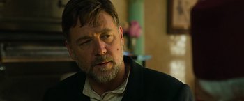 Movie still from “The Water Diviner” (2014), directed by Russell Crowe – A person wearing a suit; Close Up shot, Over the shoulder angle