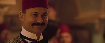 Movie still from “The Water Diviner” (2014), directed by Russell Crowe – A person wearing a fez; Close Up shot, Over the shoulder angle