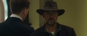 Movie still from “The Water Diviner” (2014), directed by Russell Crowe – A person wearing a hat; Close Up shot, Over the shoulder angle