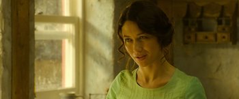 Movie still from “The Water Diviner” (2014), directed by Russell Crowe – A woman in a green shirt is looking at the camera; Close Up shot, Over the shoulder angle