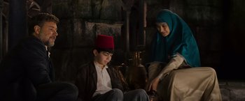 Movie still from “The Water Diviner” (2014), directed by Russell Crowe – A man and a woman sitting next to each other; Medium shot, Over the shoulder angle