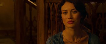 Movie still from “The Water Diviner” (2014), directed by Russell Crowe – A beautiful woman in a blue dress looking at the camera; Close Up shot, Over the shoulder angle