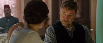 Movie still from “The Water Diviner” (2014), directed by Russell Crowe – A man and a woman sitting in front of each other; Close Up shot, Over the shoulder angle