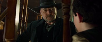 Movie still from “The Water Diviner” (2014), directed by Russell Crowe – A man in a black hat and a black jacket; Close Up shot, Low angle