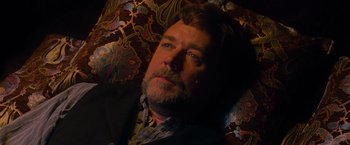 Movie still from “The Water Diviner” (2014), directed by Russell Crowe – A person wearing a suit and tie; Close Up shot, High angle