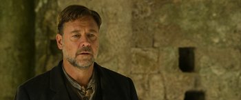Movie still from “The Water Diviner” (2014), directed by Russell Crowe – A person wearing a suit and tie; Close Up shot, Low angle