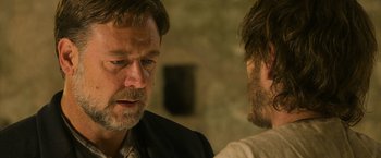 Movie still from “The Water Diviner” (2014), directed by Russell Crowe – Two men talking to each other in front of a brick wall; Close Up shot, Over the shoulder angle