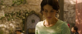 Movie still from “The Water Diviner” (2014), directed by Russell Crowe – A beautiful young lady wearing a green dress; Close Up shot, Over the shoulder angle