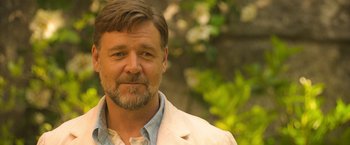 Movie still from “The Water Diviner” (2014), directed by Russell Crowe – A person wearing a jacket; Close Up shot, Over the shoulder angle