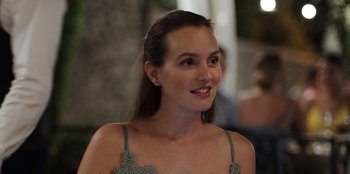 Movie still from “The Weekend Away” (2022), directed by Kim Farrant – A beautiful young lady wearing a green dress; Close Up shot, High angle