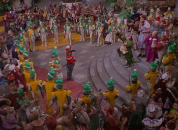 A crowd of people dressed in green and yellow costumes