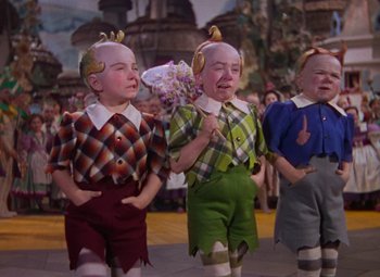 A group of young children dressed up in costumes