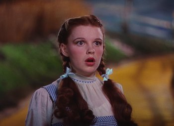 Movie still from “The Wizard of Oz” (1939), directed by Victor Fleming – A person with long hair; Close Up shot, Low angle