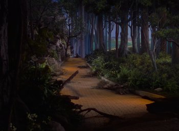 Movie still from “The Wizard of Oz” (1939), directed by Victor Fleming – A path in the middle of a forest at night time; Extreme Wide shot, High angle