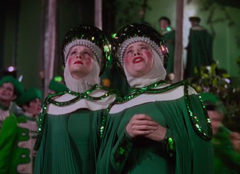 Movie still from “The Wizard of Oz” (1939), directed by Victor Fleming – A couple of women standing next to each other; Medium shot, Low angle