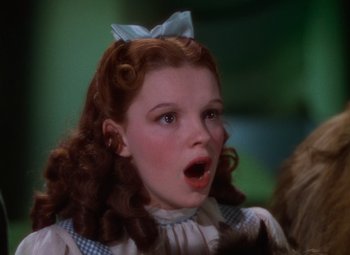 Movie still from “The Wizard of Oz” (1939), directed by Victor Fleming – A child with a surprised look on her face; Close Up shot, Low angle