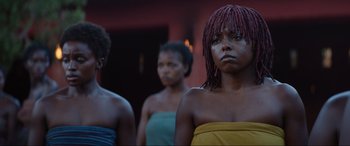 Movie still from “The Woman King” (2022), directed by Gina Prince-Bythewood – A group of women standing next to each other; Close Up shot, Low angle