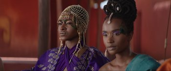 Movie still from “The Woman King” (2022), directed by Gina Prince-Bythewood – A couple of women standing next to each other; Close Up shot, Low angle
