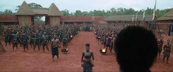 Movie still from “The Woman King” (2022), directed by Gina Prince-Bythewood – A large group of people standing in front of each other; Extreme Wide shot, High angle