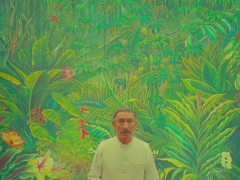 Movie still from “The Wonderful Story of Henry Sugar” (2023), directed by Wes Anderson – A man standing in front of a painting of a jungle; Medium shot, Low angle