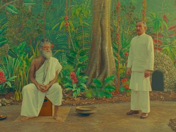 Movie still from “The Wonderful Story of Henry Sugar” (2023), directed by Wes Anderson – A painting of two men standing next to each other in front of a forest; Wide shot, High angle
