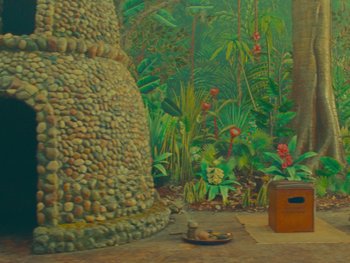 Movie still from “The Wonderful Story of Henry Sugar” (2023), directed by Wes Anderson – A cat that is sitting on the ground; Wide shot, High angle