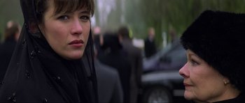 Movie still from “The World Is Not Enough” (1999), directed by Michael Apted – A person wearing a black jacket; Close Up shot, Over the shoulder angle