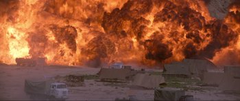 Movie still from “The World Is Not Enough” (1999), directed by Michael Apted – A large fire is coming out of the sky; Extreme Wide shot, Low angle