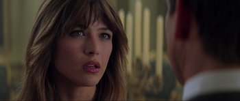 Movie still from “The World Is Not Enough” (1999), directed by Michael Apted – A person with long hair; Close Up shot, Over the shoulder angle
