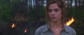 Movie still from “The World Is Not Enough” (1999), directed by Michael Apted – A person wearing a shirt; Close Up shot, Over the shoulder angle