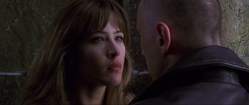 Movie still from “The World Is Not Enough” (1999), directed by Michael Apted – A man and a woman looking at one another; Close Up shot, Over the shoulder angle