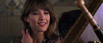 Movie still from “The World Is Not Enough” (1999), directed by Michael Apted – A person with long brown hair; Close Up shot, Over the shoulder angle