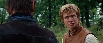 Movie still from “Eragon” (2006), directed by Stefen Fangmeier – A man and a boy are standing in the woods; Close Up shot, Over the shoulder angle