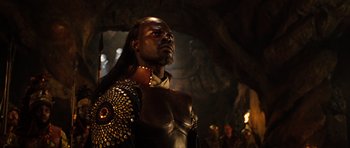 Movie still from “Eragon” (2006), directed by Stefen Fangmeier – A man in armor looking up in a cave; Close Up shot, Low angle