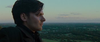 Movie still from “The World's End” (2013), directed by Edgar Wright – A person looking out over a field; Close Up shot, Low angle