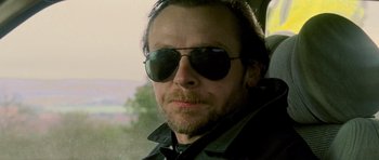 Movie still from “The World's End” (2013), directed by Edgar Wright – A person wearing sunglasses; Close Up shot, Low angle