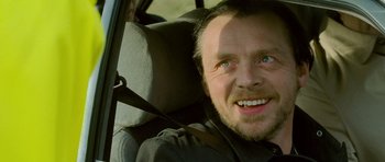Movie still from “The World's End” (2013), directed by Edgar Wright – A person sitting in a car seat; Close Up shot, Over the shoulder angle