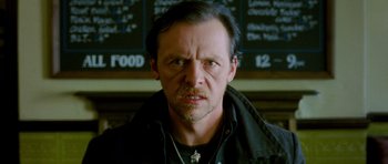 Movie still from “The World's End” (2013), directed by Edgar Wright – A person wearing a black jacket; Close Up shot, Over the shoulder angle