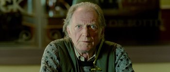 Movie still from “The World's End” (2013), directed by Edgar Wright – An old man with a long white beard wearing glasses; Close Up shot, Low angle