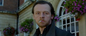 Movie still from “The World's End” (2013), directed by Edgar Wright – A person smoking a cigarette; Close Up shot, Low angle