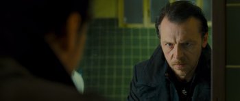 Movie still from “The World's End” (2013), directed by Edgar Wright – A man in a black jacket is looking at another man in a black jacket; Close Up shot, Over the shoulder angle