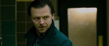 Movie still from “The World's End” (2013), directed by Edgar Wright – A person wearing a green jacket; Close Up shot, Over the shoulder angle