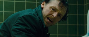 Movie still from “The World's End” (2013), directed by Edgar Wright – A person in a green jacket; Close Up shot, Low angle