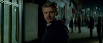 Movie still from “The World's End” (2013), directed by Edgar Wright – A person standing in a dark place; Close Up shot, Low angle